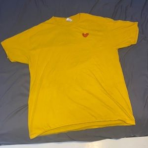 Yellow broken heart t-shirt.